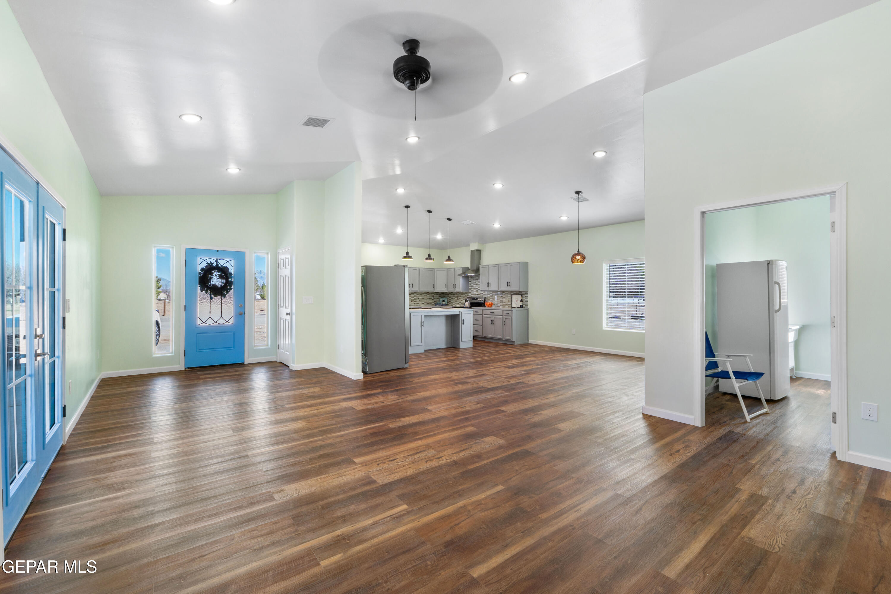 646 Snow Road, Unit 2 Las Cruces, NM 88005 - Photo 7 of 41 a view of a big room with wooden floor and windows
