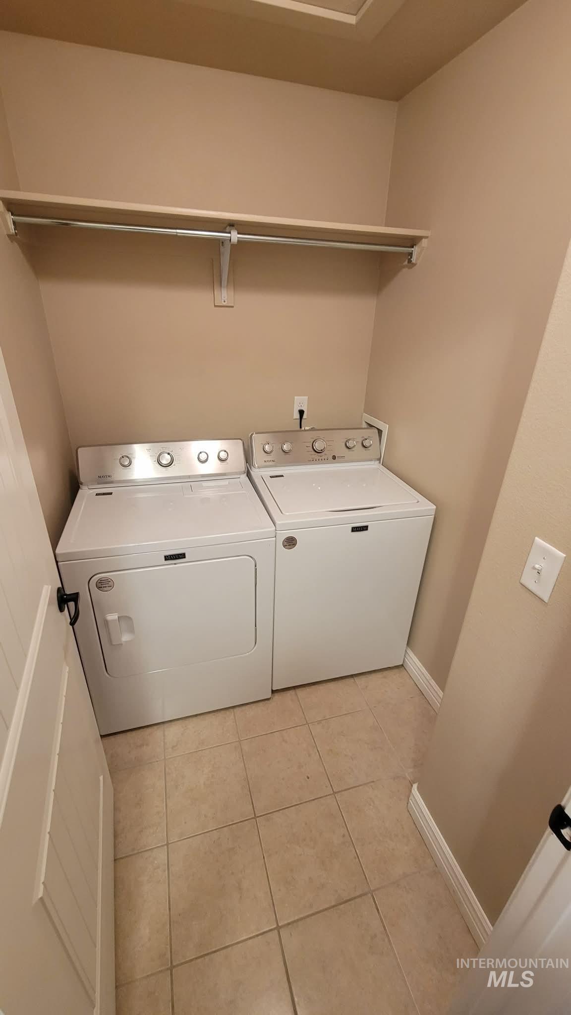 470 Sunflower Road Rexburg, ID 83440 - Photo 14 of 16 Laundry room with light tile patterned floors and washer and dryer