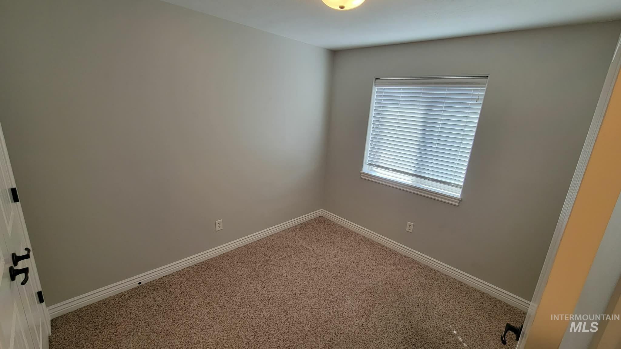 470 Sunflower Road Rexburg, ID 83440 - Photo 9 of 16 Carpeted spare room with baseboards