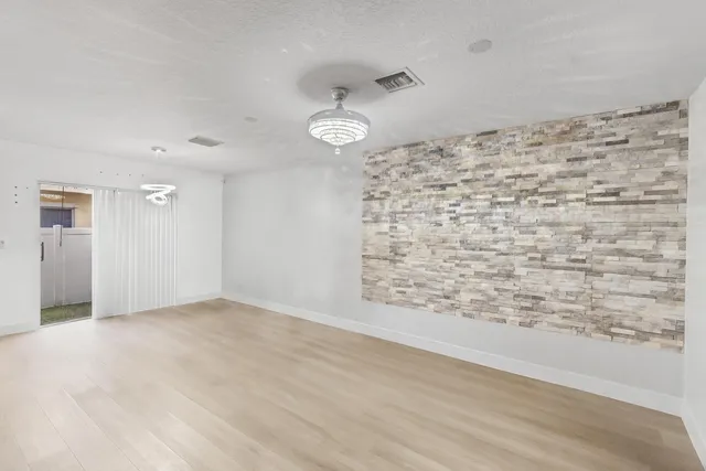 wooden floor in a hall with an entryway