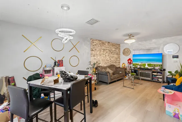 a living room with furniture a rug and a large window
