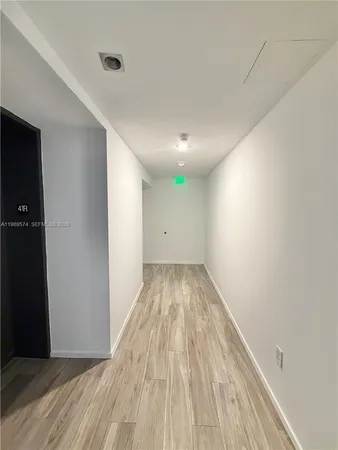 wooden floor in a hall with an entryway