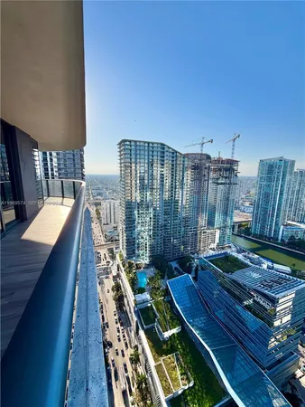 a view of a balcony with chairs