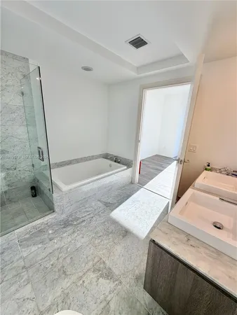 a bathroom with a sink and a shower