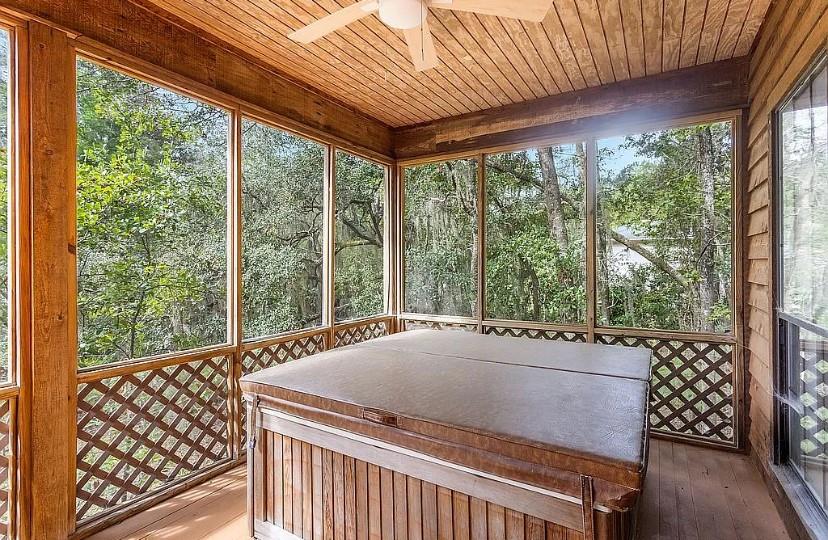 1525 Black Island Road Darien, GA 31305 - Photo 30 of 41 a view of a patio with a table chairs and wooden fence