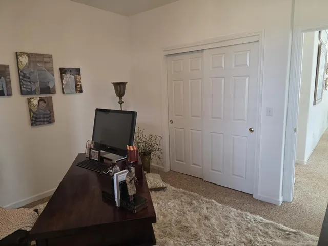 a view of workspace with wooden floor windows