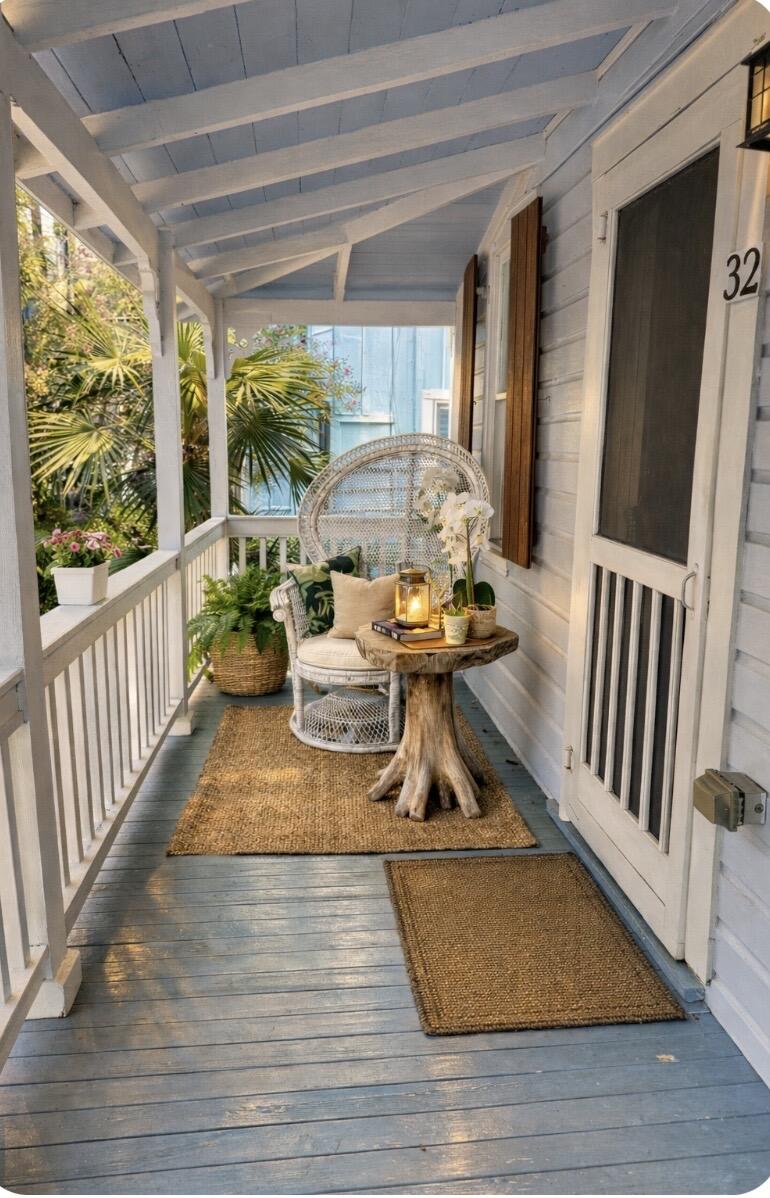 322 Southard Street Key West, FL 33040 - Photo 2 of 35 a view of a dining room with furniture window and wooden floor