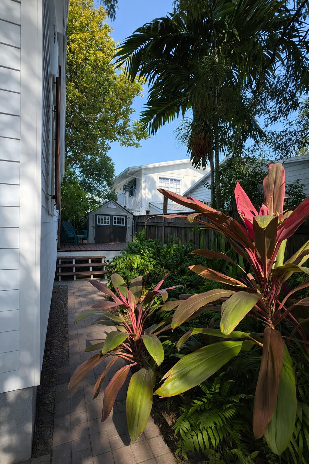 322 Southard Street Key West, FL 33040 - Photo 34 of 35 a backyard of a house with lots of green space