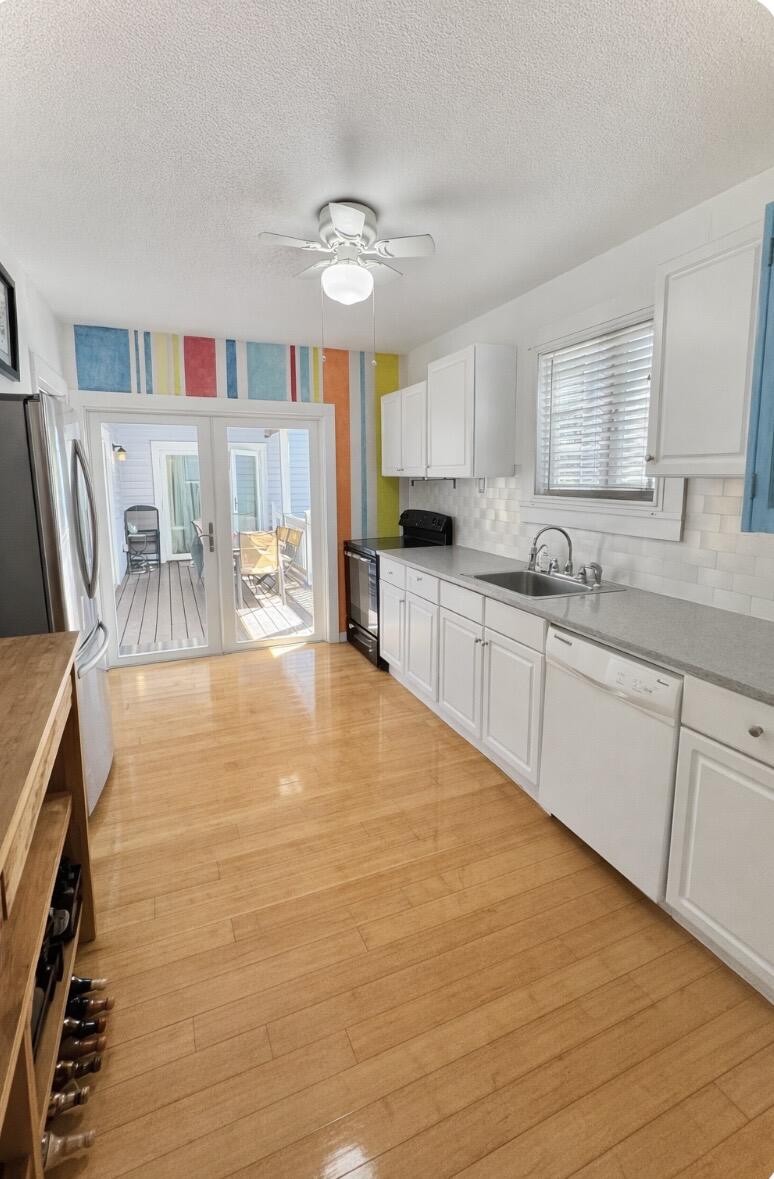 322 Southard Street Key West, FL 33040 - Photo 9 of 35 front of the house kitchen entry