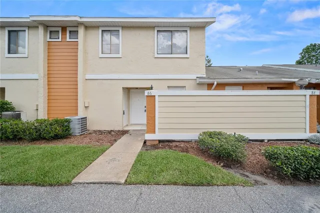 a view of a house with a yard