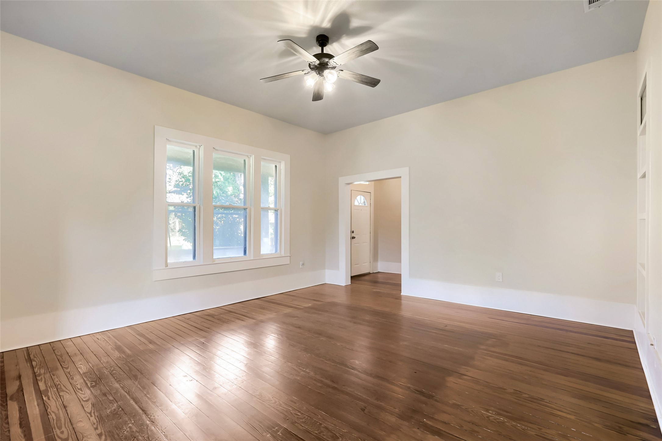 208 North Ave B Elgin, TX 78621 - Photo 13 of 29 Living room looking at front door.