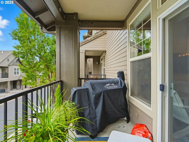 a view of balcony with furniture