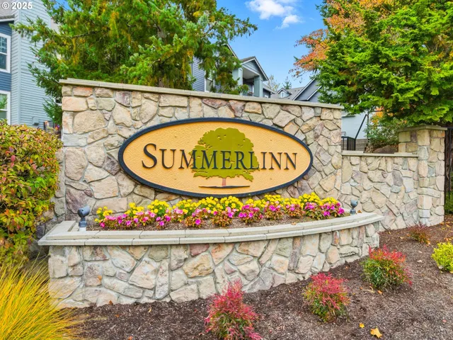 a living room with furniture a fireplace and a table