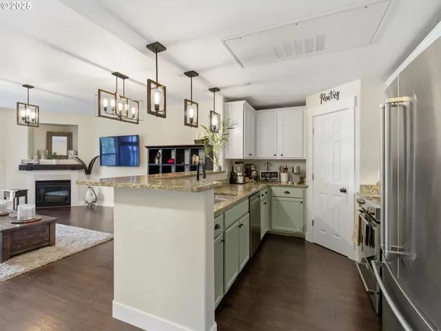 a kitchen with cabinets and stainless steel appliances