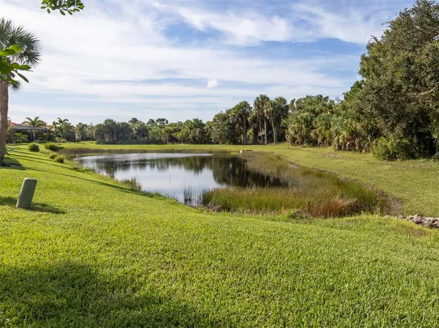 a kitchen with stainless steel appliances granite countertop a sink a stove counter space and cabinets