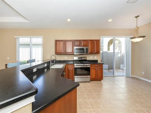 a bathroom with a shower sink and mirror