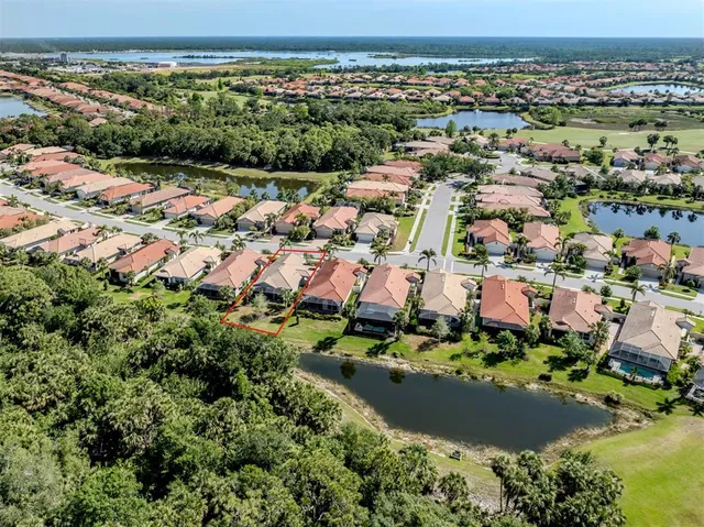 a view of a patio with a table chairs and a garden