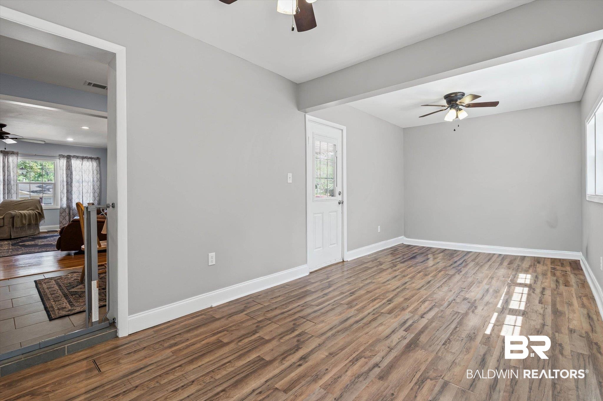 5609 Diane Court Mobile, AL 36618 - Photo 10 of 22 Unfurnished room with a ceiling fan and wood finished floors