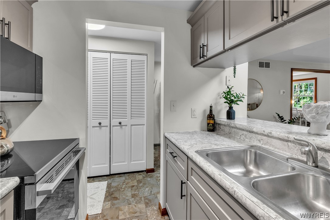 4765 Chestnut Ridge Road, Unit 4 Amherst, NY 14228 - Photo 11 of 45 Pantry w/ shuttered doors