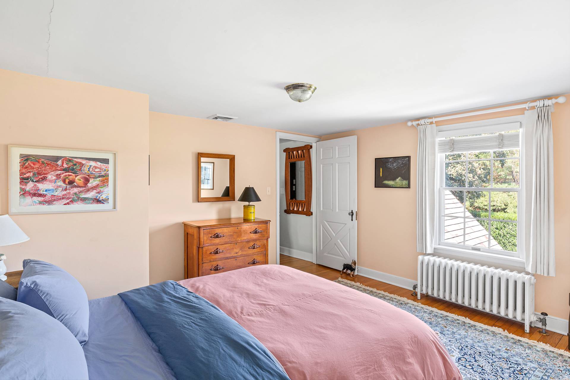 406 Hayground Road Water Mill, NY 11976 - Photo 11 of 20 a bedroom with a bed and wooden floor