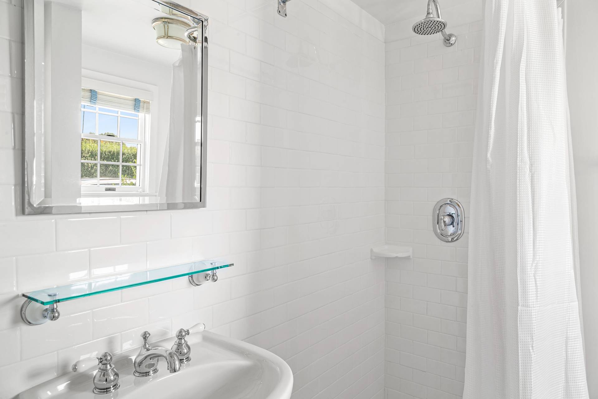 406 Hayground Road Water Mill, NY 11976 - Photo 16 of 20 a bathroom with a sink and a window