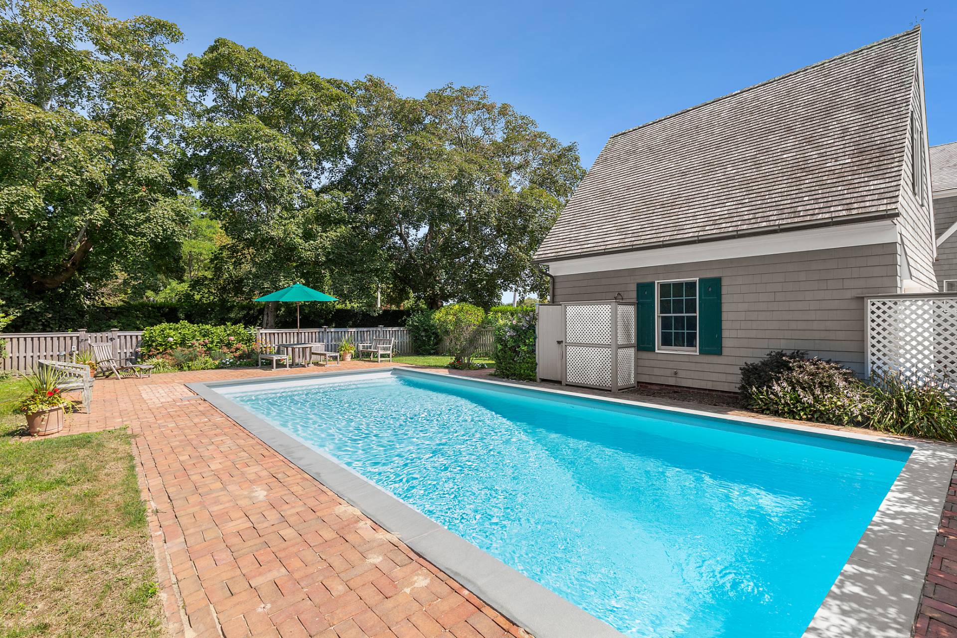406 Hayground Road Water Mill, NY 11976 - Photo 18 of 20 a view of a backyard with swimming pool