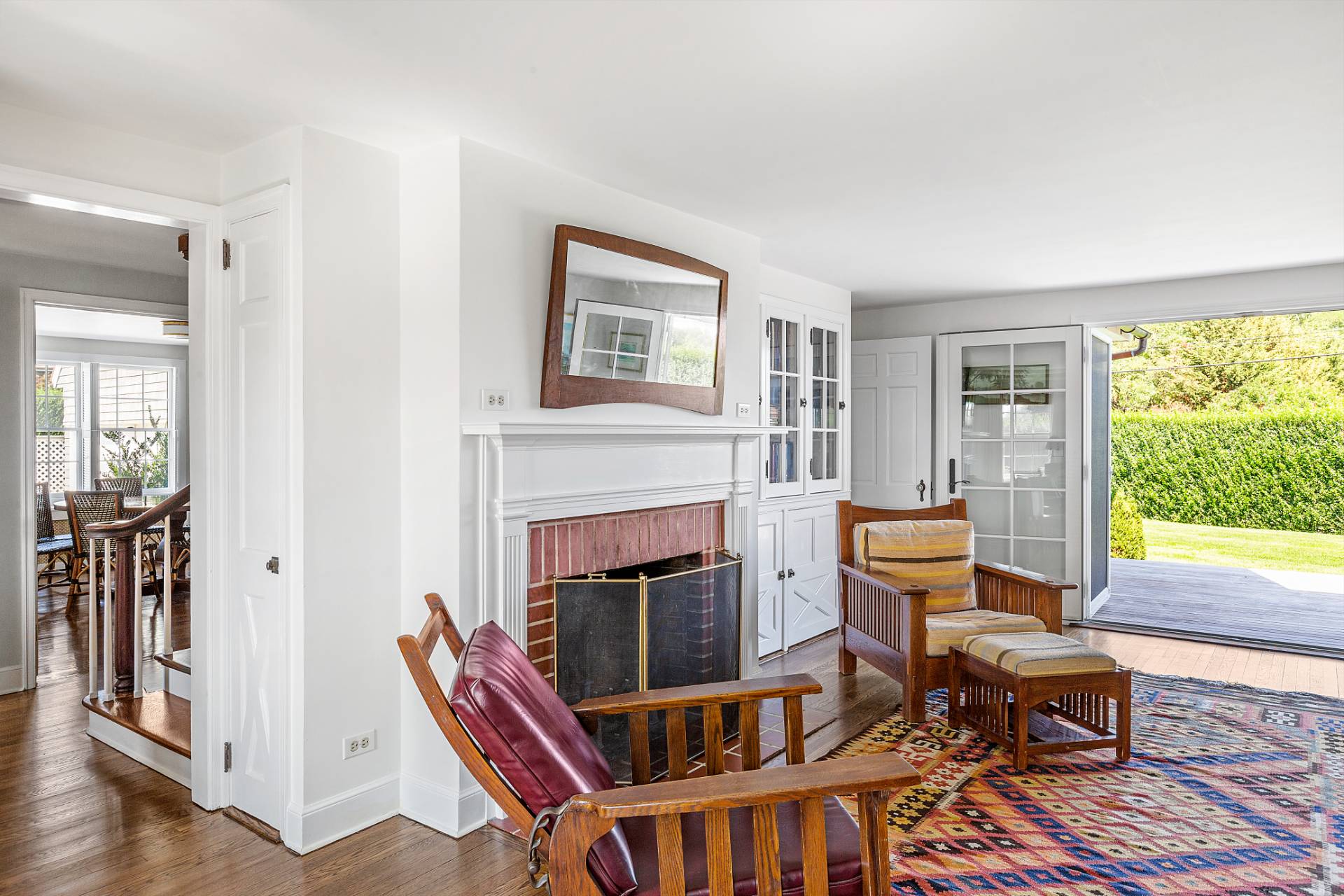406 Hayground Road Water Mill, NY 11976 - Photo 6 of 20 a living room with furniture a fireplace and a large window