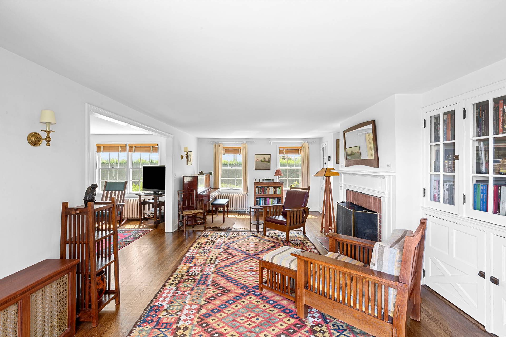 406 Hayground Road Water Mill, NY 11976 - Photo 7 of 20 a living room with fireplace furniture and a flat screen tv