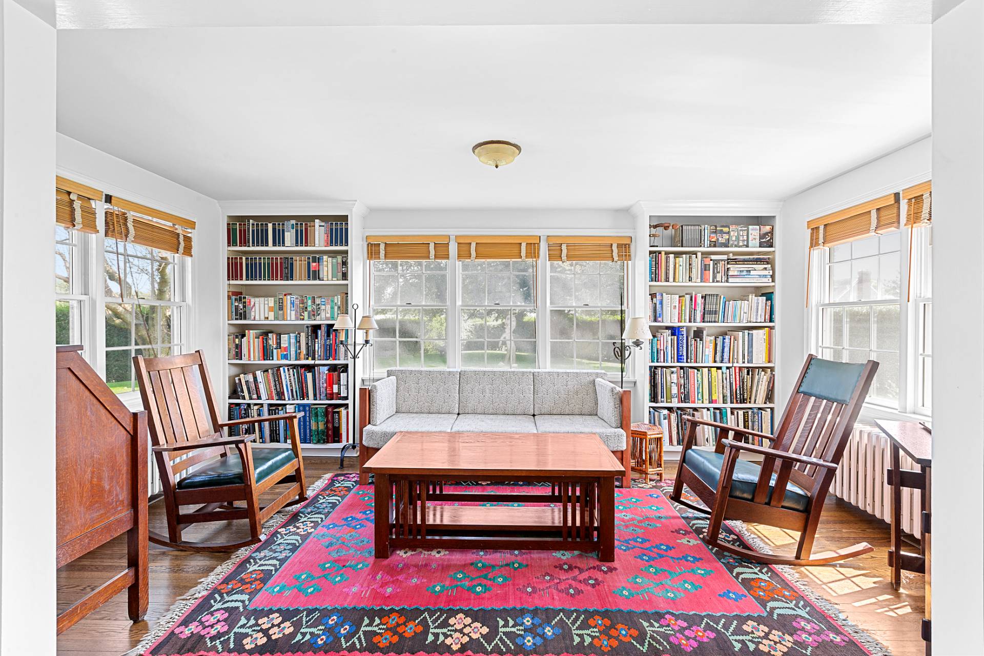 406 Hayground Road Water Mill, NY 11976 - Photo 8 of 20 a living room with furniture a rug and a book shelf
