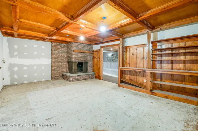 a view of a room with wooden walls