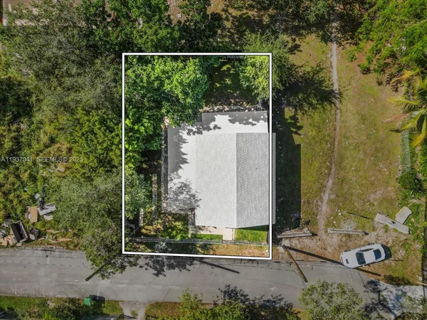 a view of a house with backyard porch and sitting area