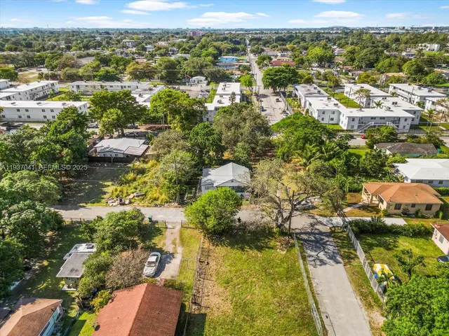 a view of a chair and tables in the patio