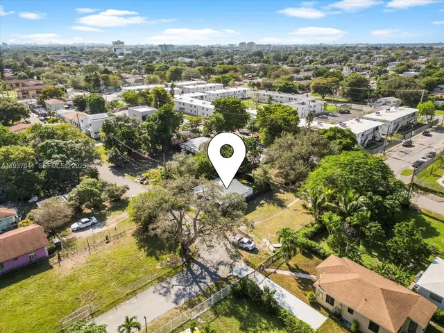 a kitchen with kitchen island granite countertop a sink and a counter top space