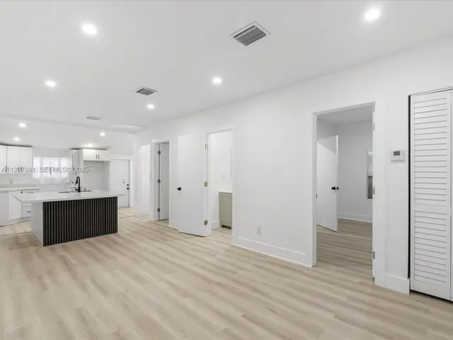 a bathroom with a toilet sink and shower