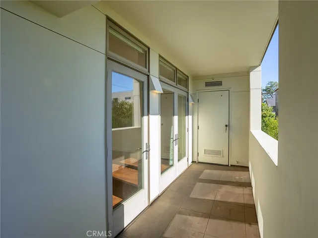 a view of a dining room with furniture and window