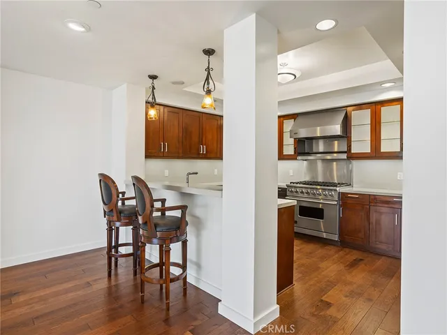a view of a dining room with furniture wooden floor and window