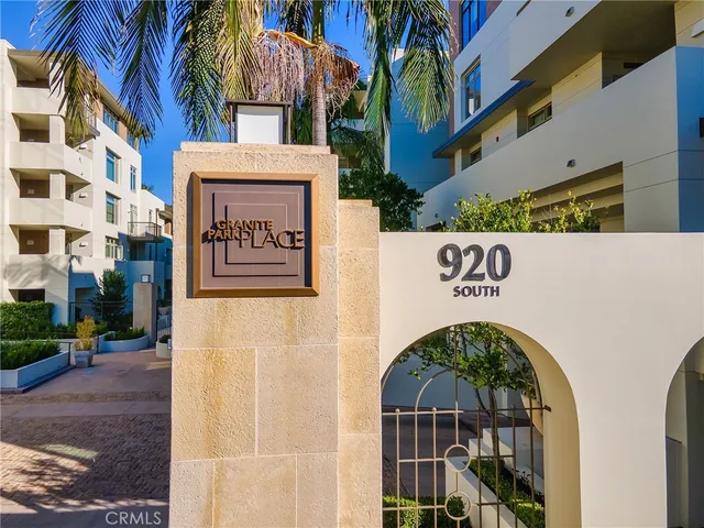 a view of a patio with plants and a fireplace