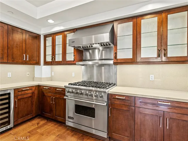 a kitchen with granite countertop a stove and a sink
