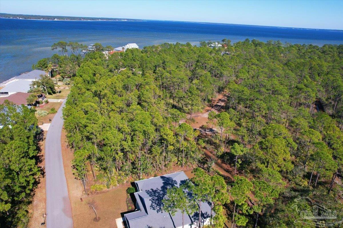 5433 North Shore Road Pensacola, FL 32507 - Photo 11 of 28 a view of a yard with an outdoor space and deck