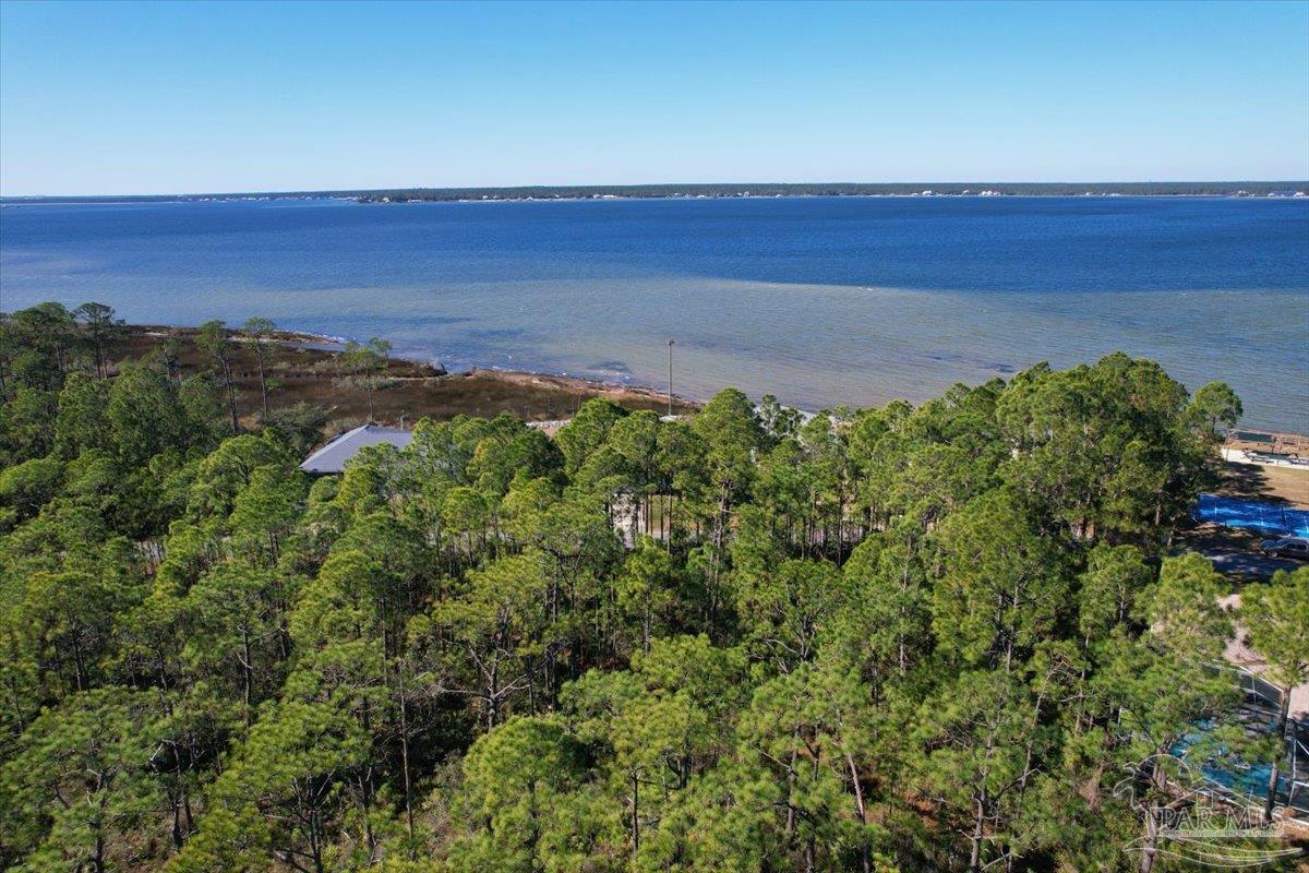 5433 North Shore Road Pensacola, FL 32507 - Photo 19 of 28 a view of a yard with an outdoor space and seating area