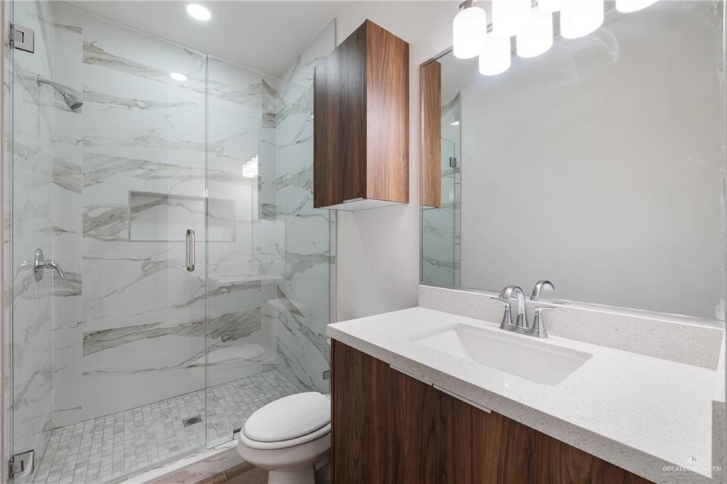 2904 Gabriel Street, Unit 3 Mission, TX 78574 - Photo 12 of 13 a bathroom with a sink a toilet and shower