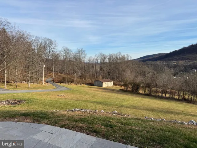 a view of a yard with an ocean view