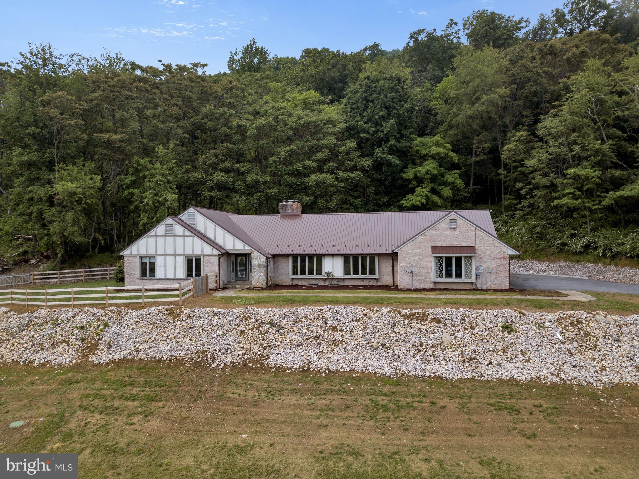 210 Raintree Lane Fairfield, PA 17320 - Photo 21 of 23 a front view of a house with a garden