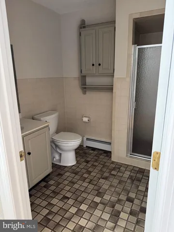 a bathroom with a toilet and a sink