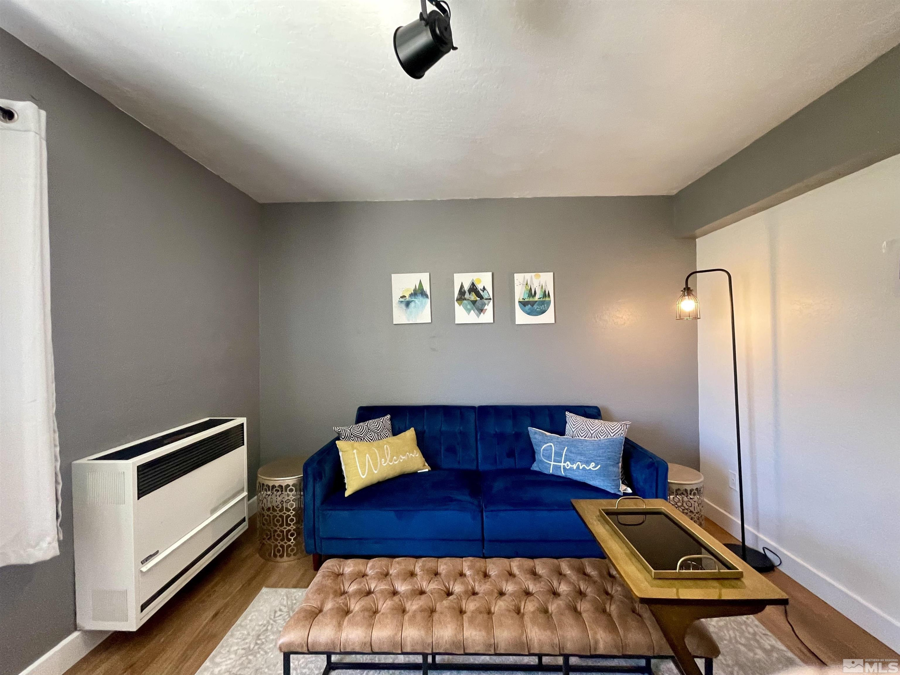 261 Quaking Aspen Lane, Unit B Stateline, NV 89449 - Photo 23 of 40 a living room with furniture and a rug