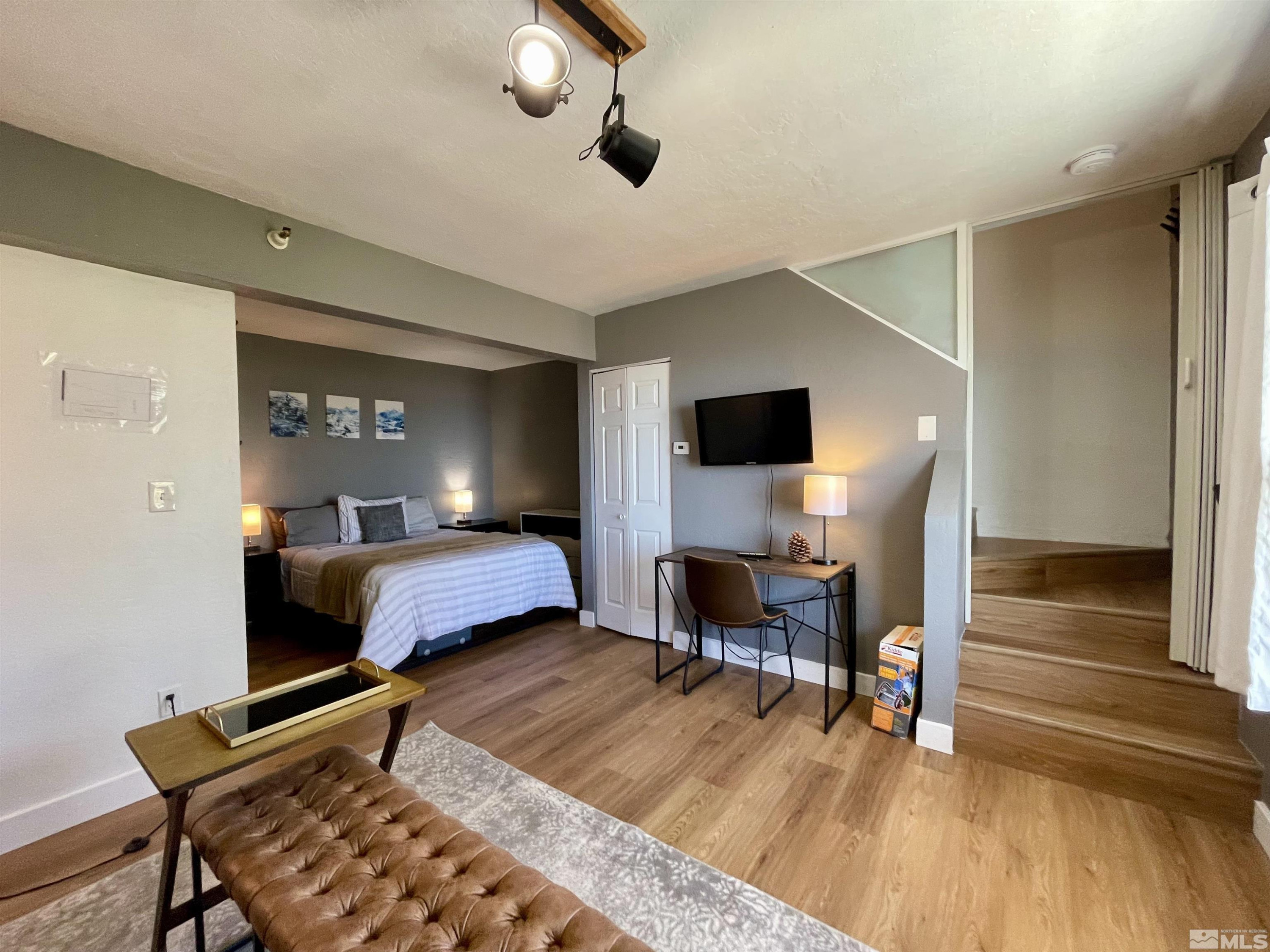 261 Quaking Aspen Lane, Unit B Stateline, NV 89449 - Photo 26 of 40 a bedroom with furniture and a wooden floor