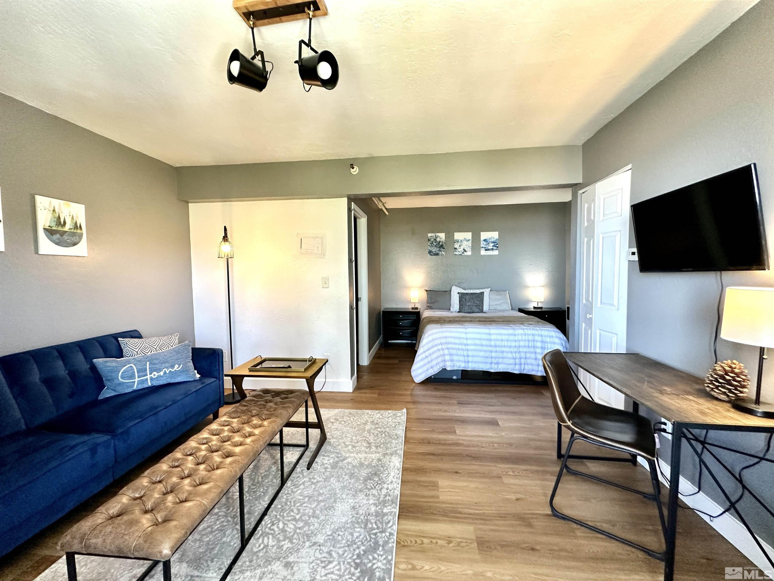 261 Quaking Aspen Lane, Unit B Stateline, NV 89449 - Photo 27 of 40 a living room with furniture and a flat screen tv