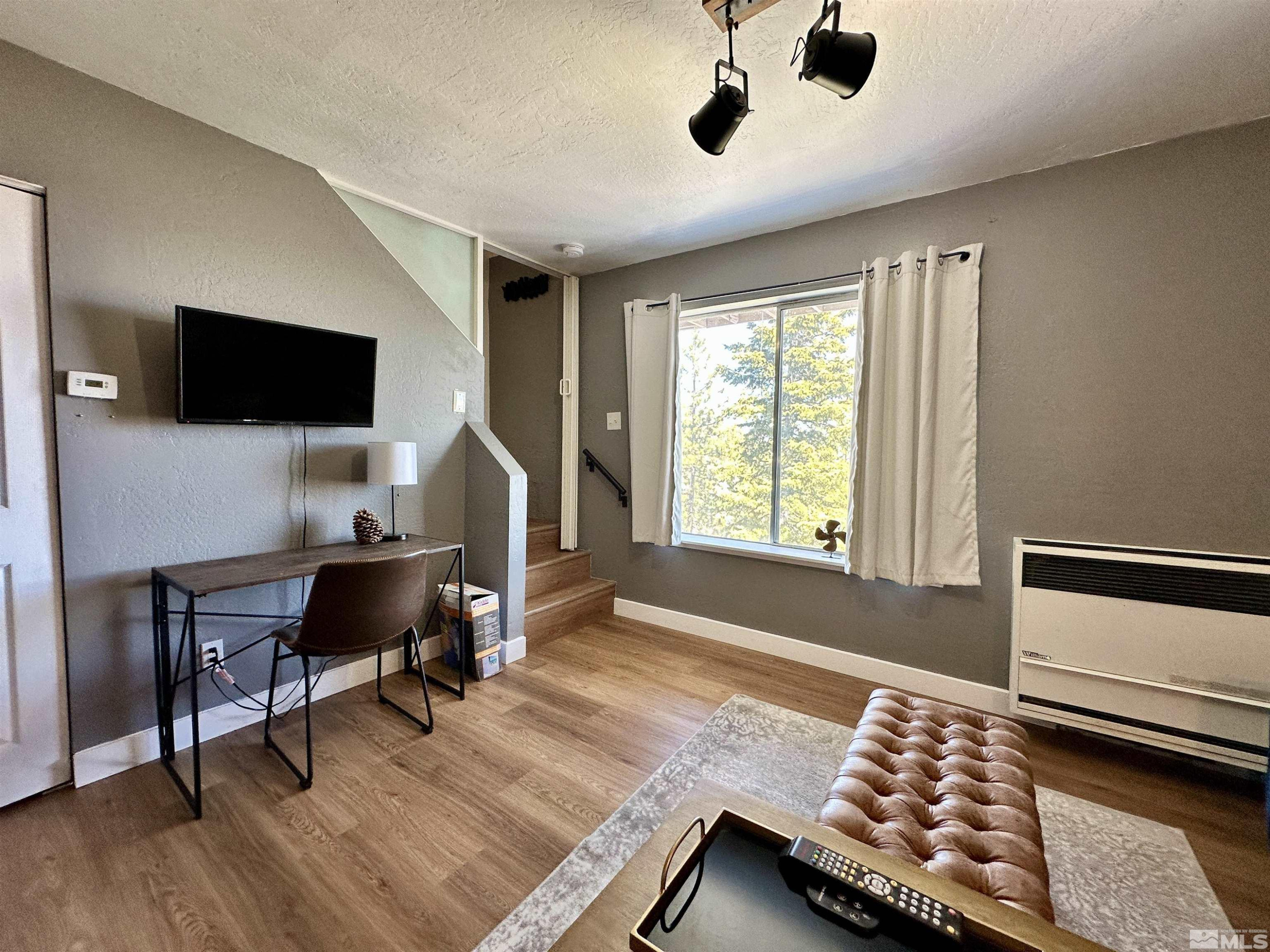 261 Quaking Aspen Lane, Unit B Stateline, NV 89449 - Photo 30 of 40 a workspace with a window