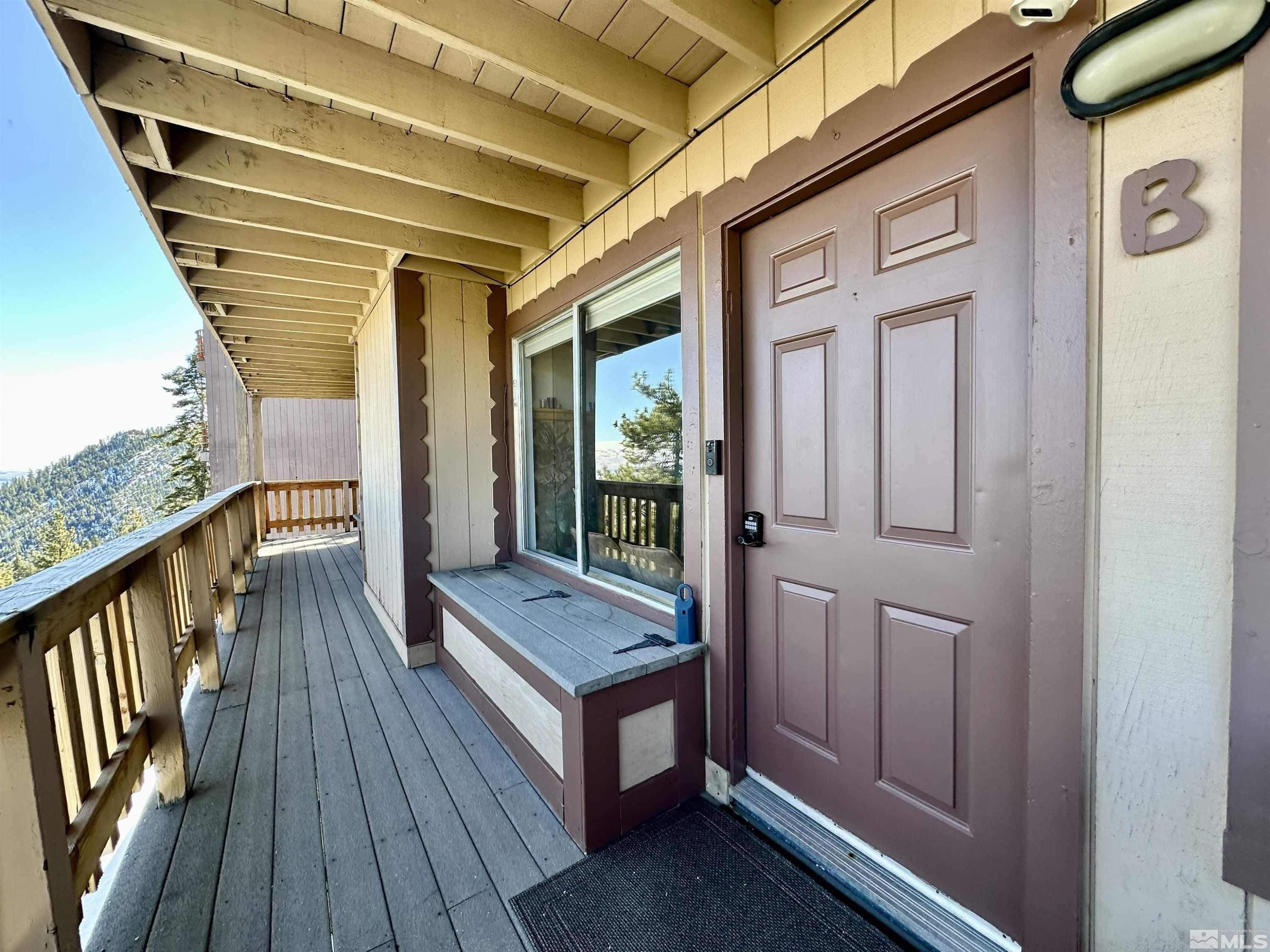 261 Quaking Aspen Lane, Unit B Stateline, NV 89449 - Photo 34 of 40 a view of a balcony with wooden floor