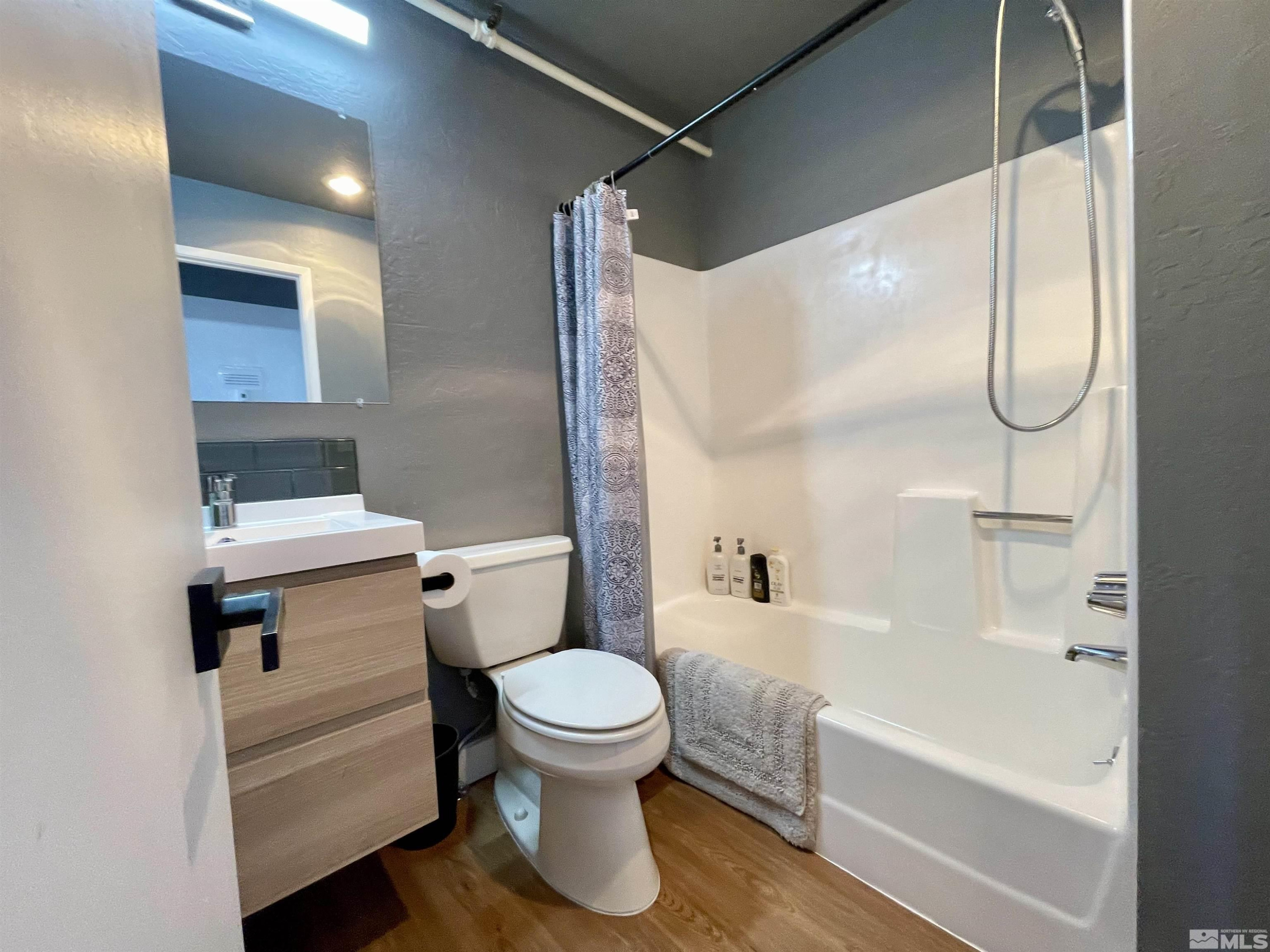 261 Quaking Aspen Lane, Unit B Stateline, NV 89449 - Photo 35 of 40 a bathroom with a toilet and a bathtub